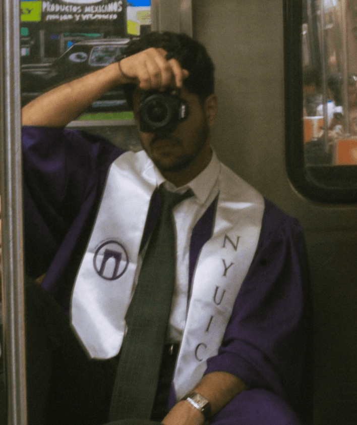 Amaan Nehru photographing on the NYC subway